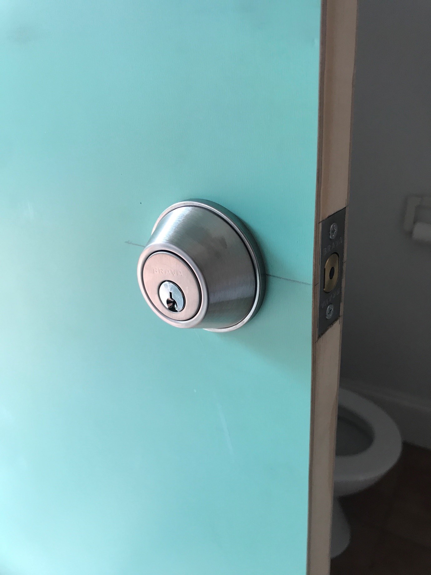 Installing new laundry door lock for improved home security in Mitcham