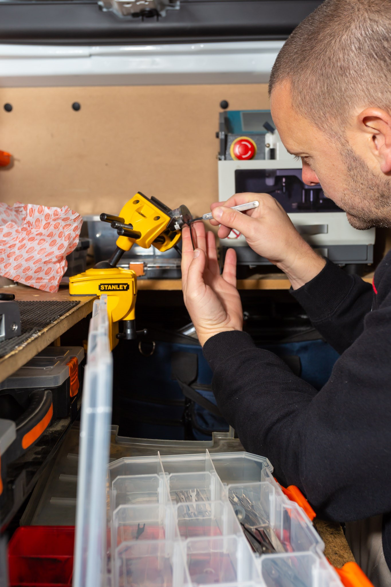 Locksmith re-pinning lock cylinder during rekeying service in Melbourne