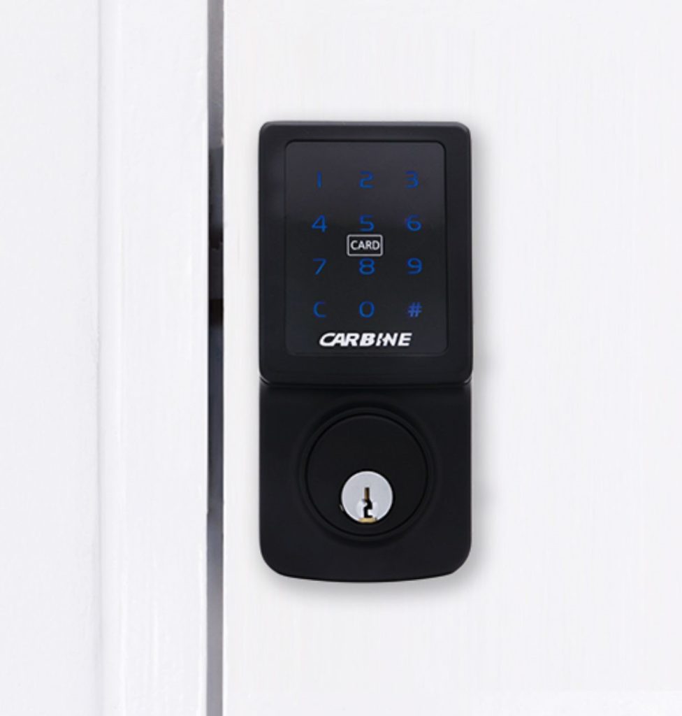 Carbine CEL digital deadbolt with illuminated keypad installed on white door — supplied by Frontline Locksmiths Melbourne