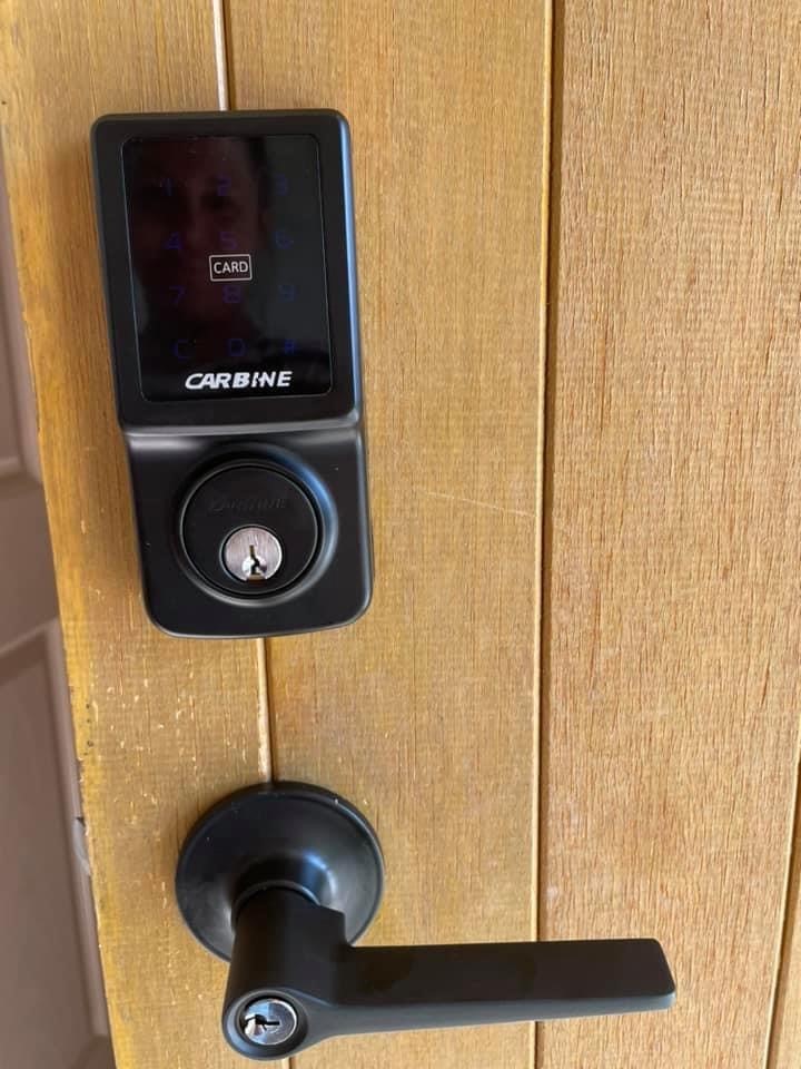 Carbine CEL digital lock with keypad and lever handle installed on timber door by Frontline Locksmiths Melbourne