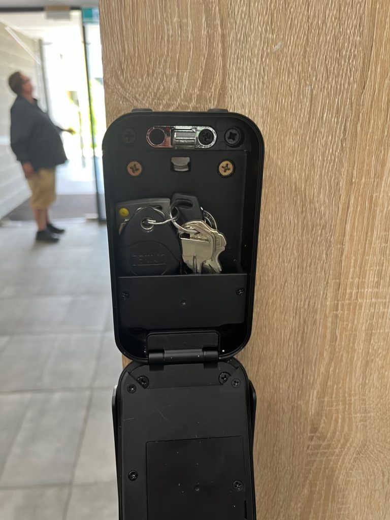 Digital key safe installed in apartment common area for owners corporation access in Box Hill