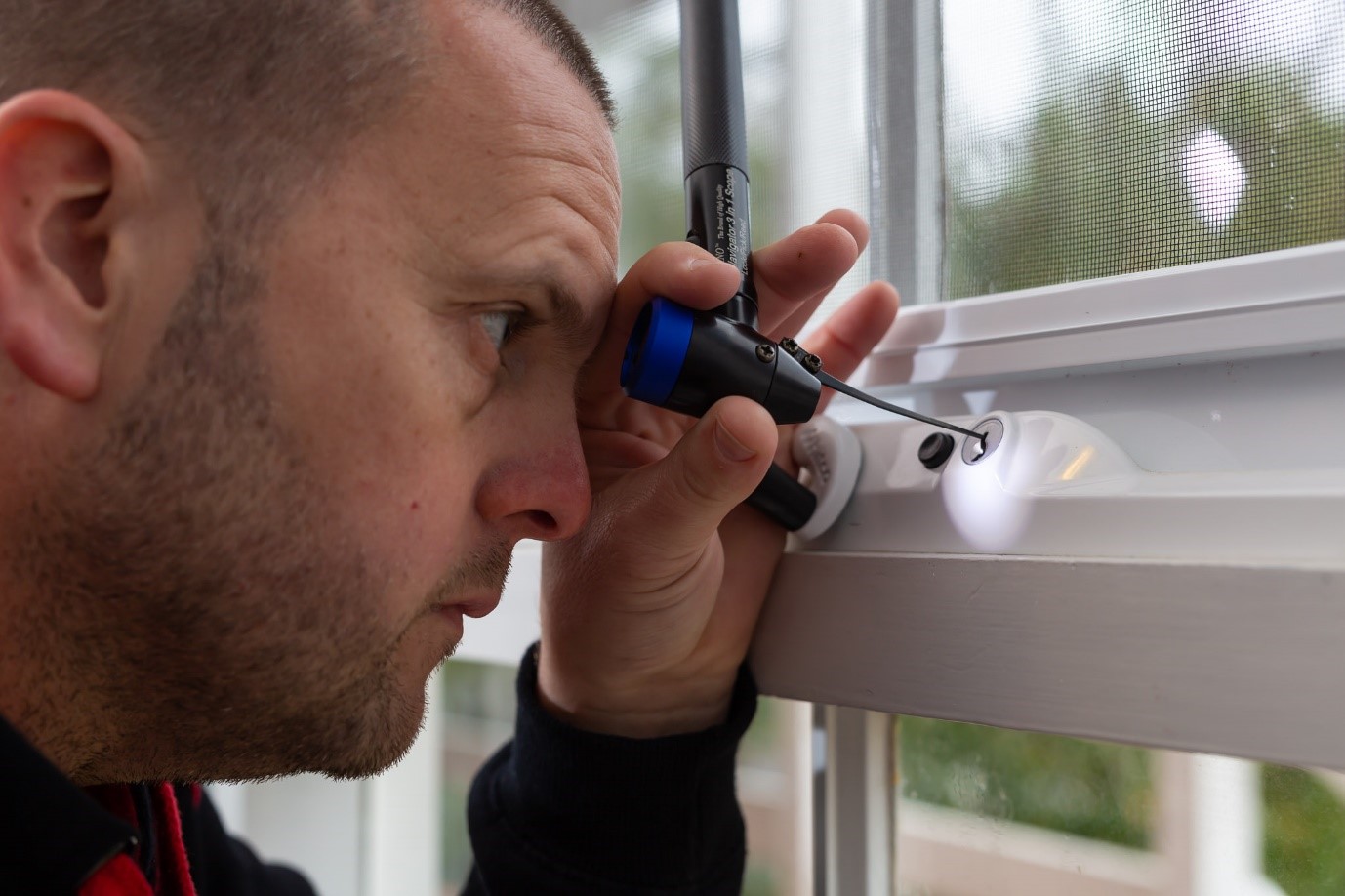 Locksmith reprogramming garage remote and checking garage security system after house move in Melbourne